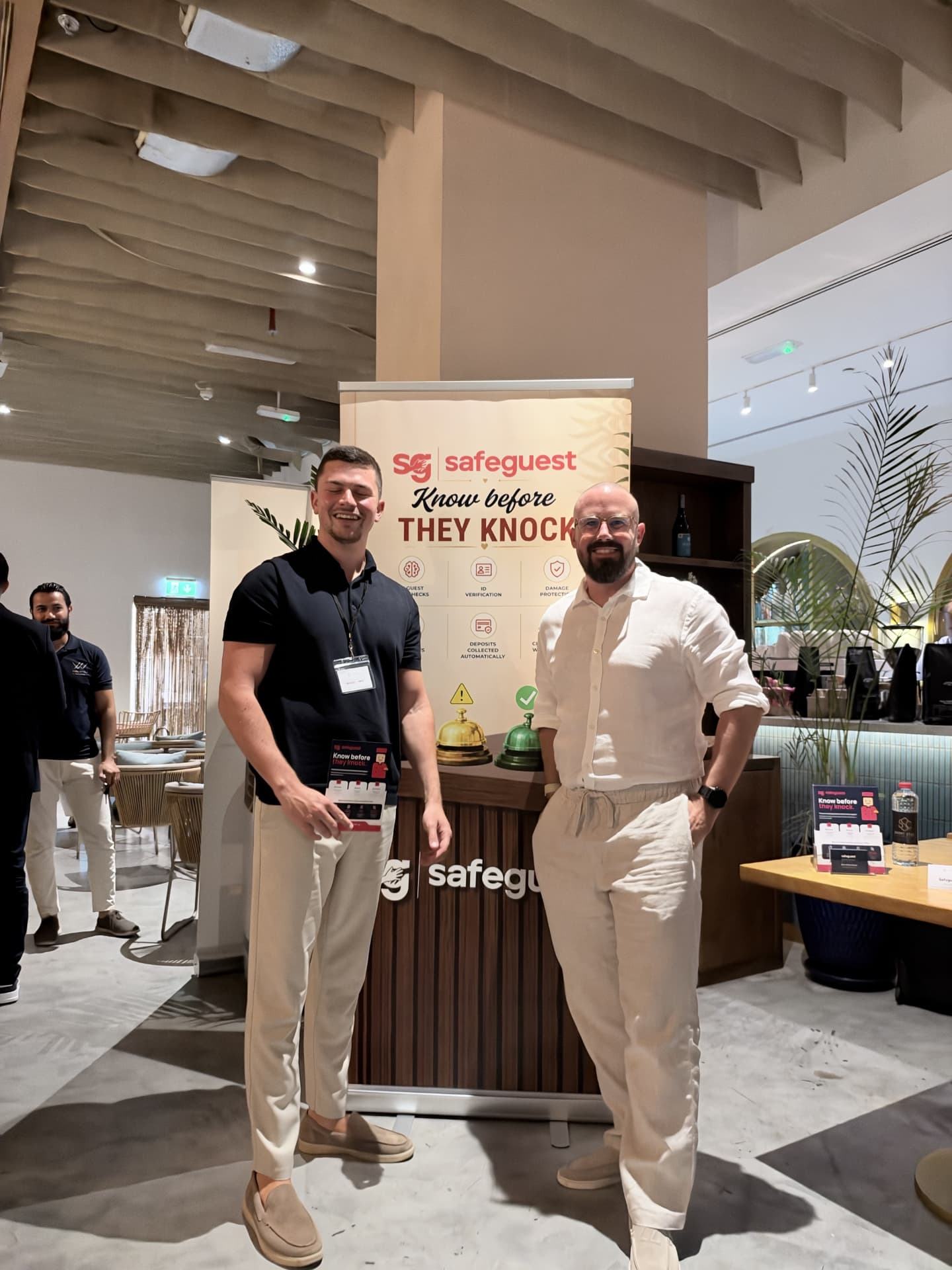 The Safeguest team with their roller banner at Short Stay Circle in Dubai.