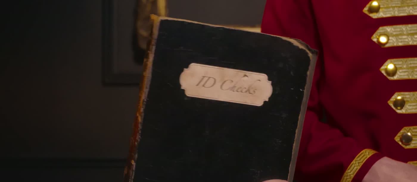 The Safeguest bellhop holding an identity-check ledger